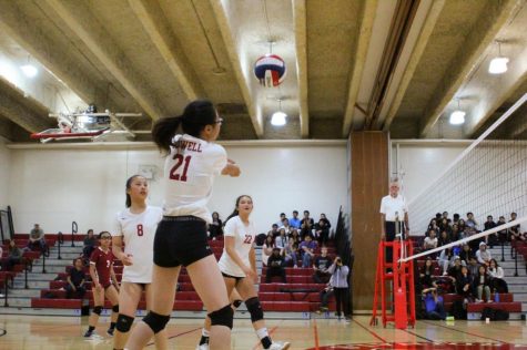 Freshman Heather Liu bumps the ball back over the net on Sept. 14 against the Washington Eagles in the annual Battle of the Birds volleyball game.