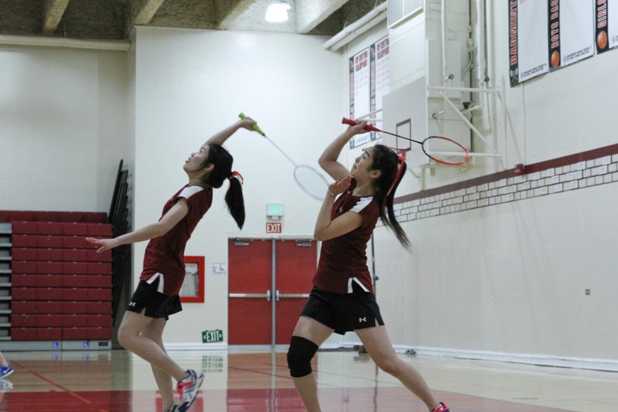 Senior Joanna Feng (right) and Elaine Huang (left) demonstrate strong partnership at the match against the Galileo Lions on Mar. 12 at home. 