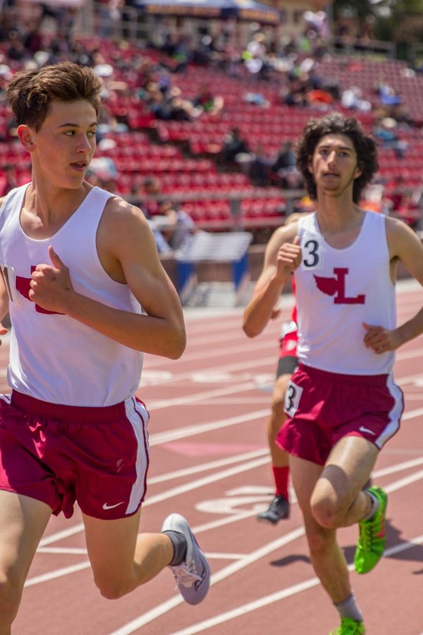 Sophomore Andrew Blelloch looks back at freshman Paolo Canigiula in the frosh-soph boys 1600m run. Canigiula ended up beating Blelloch by four seconds.