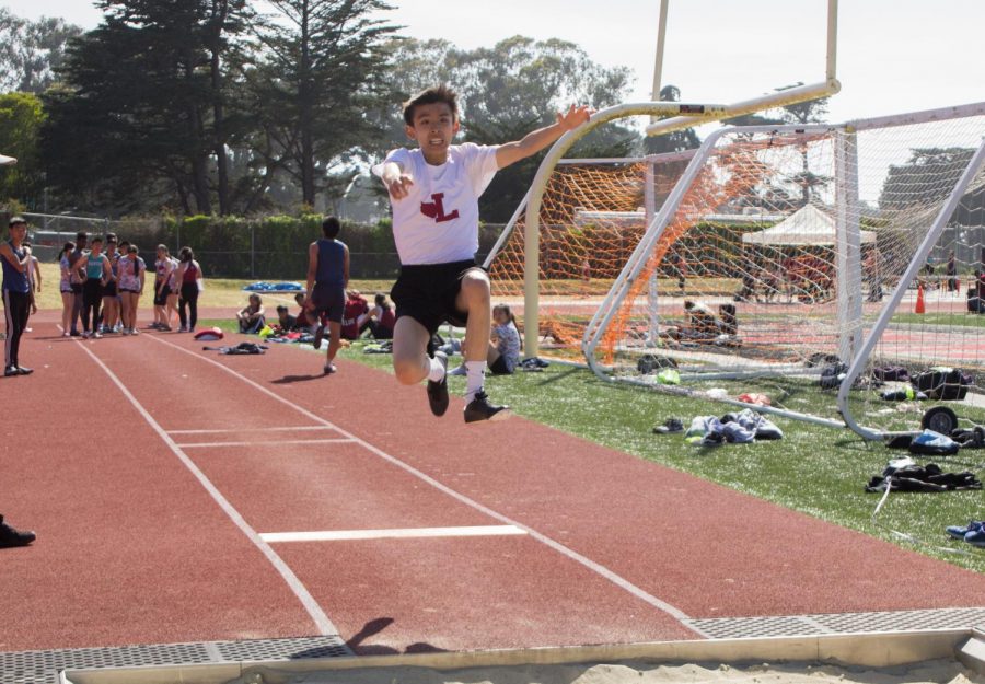 Freshman Benjamin Yee in the long jump for the frosh-soph boys division.