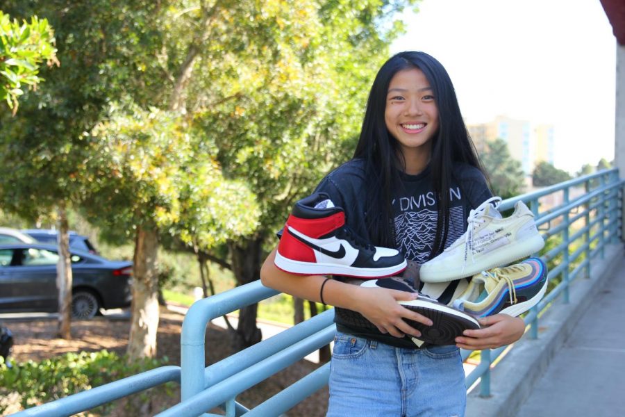 Sophomore Hunter Chan posing with Sneakerhunt shoe inventory 