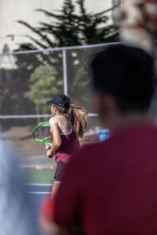 Sophomore+Danielle+Vakutin+is+pictured+setting+up+for+their+opponents+serve.+Photo+by+Nico+Ramirez.