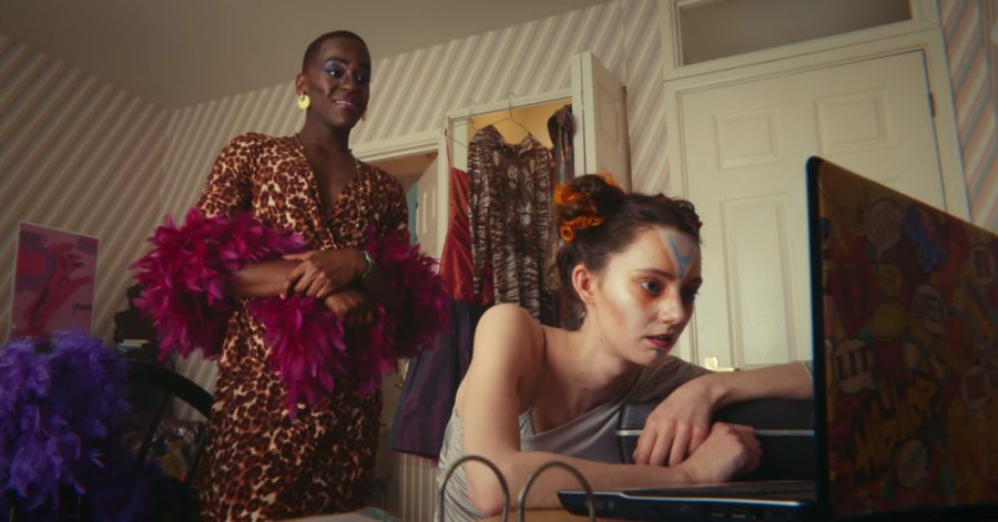 Eric shows gay porn to his curious friend after giving her a makeover. Photo from Netflix. 