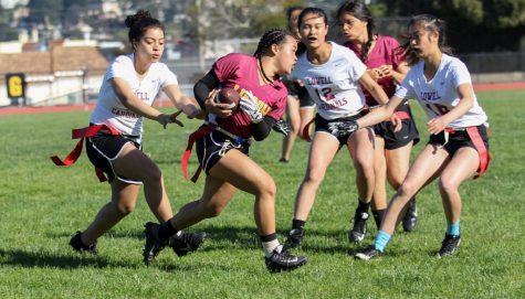 Sophomore rusher Darcy Munoz, senior linebackers Fanny Lee (12) and Carmen Chen (18) work together to “tackle” a Mustang. 