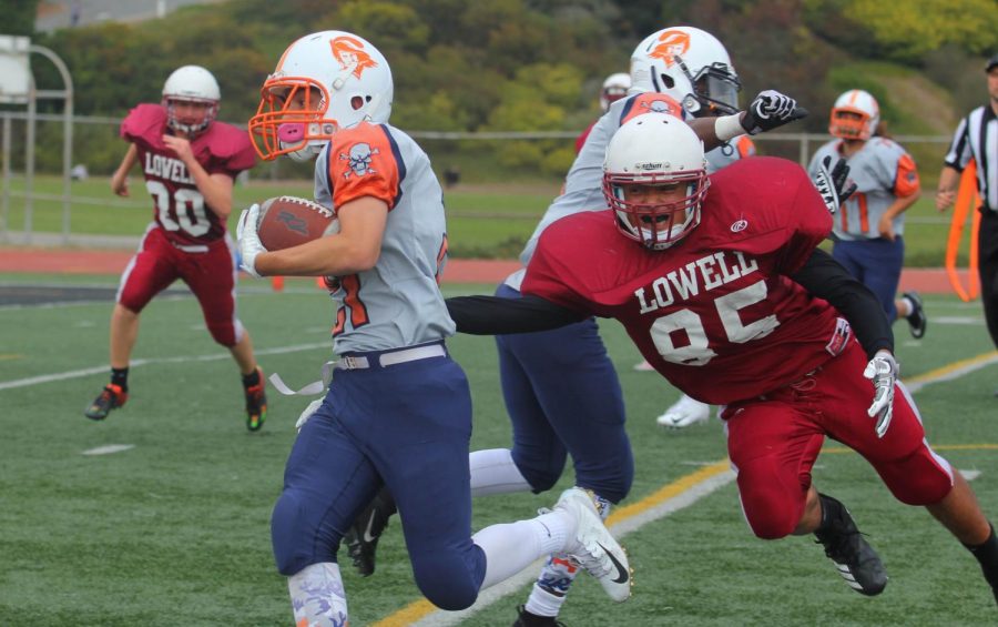 Sophomore running back and middle linebacker Anthony Serrano attempts to tackle his opponent.