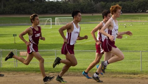 Freshman Ben Lester and seniors Henry Lei, James Holcombe, Beck Johnstone at the first curve of the Polo Fields.