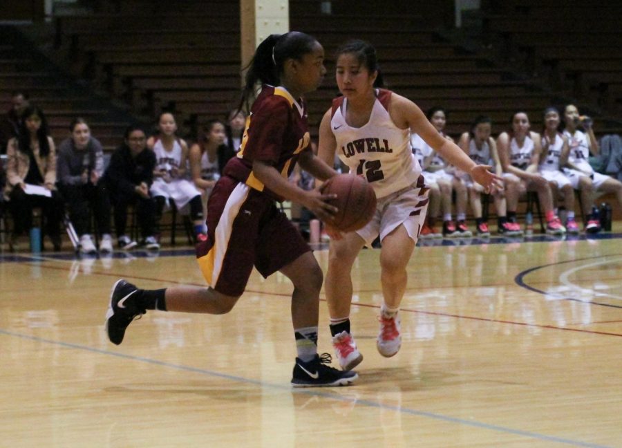 Sophomore guard Jaelyn Braganza blocks a Lincoln Mustang from advancing down the court during the annual AAA championship on Feb. 15 at Kezar Stadium.