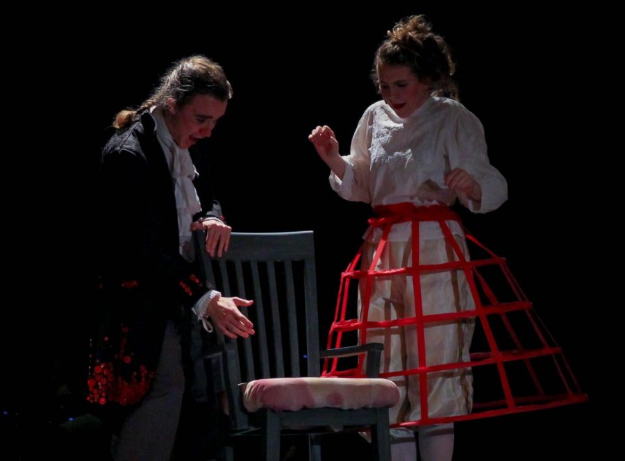 Junior Ariel Anderson, as Sweeney Todd, and senior Bel Mehaffy, as Mrs. Lovett,  marvel over Todds new barber chair.
