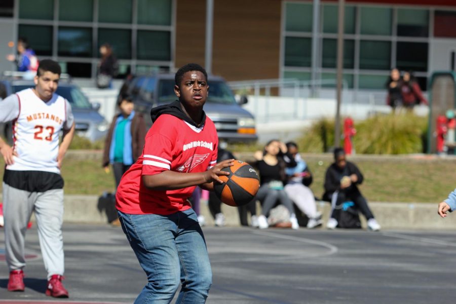 Sophomore Damareya Harrison positions to make a shot during a Special Olympics basketball tournament.