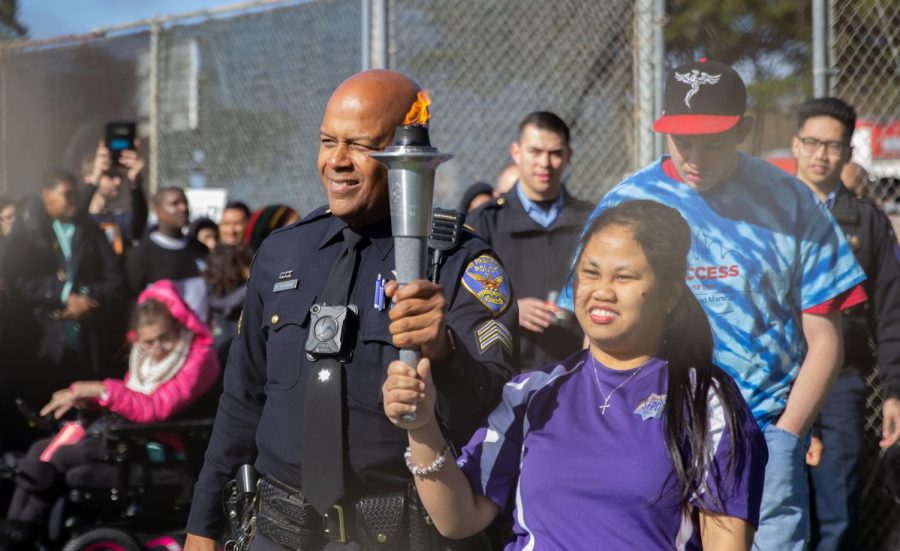 SFPD policeman and Special Olympics participant held the Olympic torch together during the opening ceremony. 