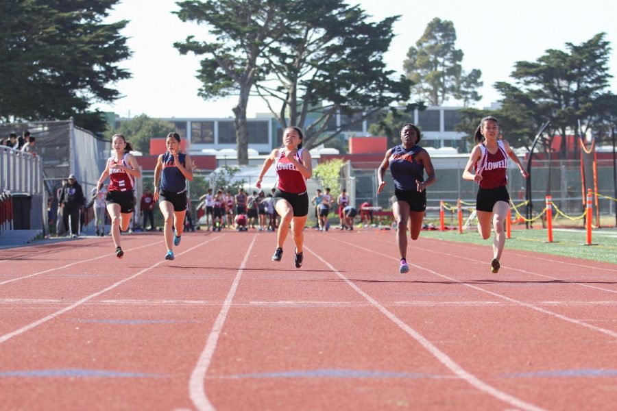 Seniors Iryne Chu, Kathleen Mai and Emily Liu in the varsity girls 100m dash with two Balboa Bucs. Liu came in first with a time of 12.94.